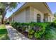 Charming exterior view of a well-maintained home with neatly trimmed landscaping and fresh green lawn at 2547 Stony Brook Ln, Clearwater, FL 33761