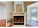 Close up of fireplace with tile surround and view to patio at 2547 Stony Brook Ln, Clearwater, FL 33761