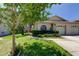 Charming home with a well-manicured lawn and landscaping, enhancing its curb appeal at 2547 Stony Brook Ln, Clearwater, FL 33761