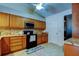 Efficient kitchen with sleek black appliances, granite countertops, and light tile flooring at 2547 Stony Brook Ln, Clearwater, FL 33761