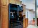 Modern kitchen featuring stainless steel fridge and wood cabinets at 2547 Stony Brook Ln, Clearwater, FL 33761