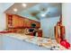Bright kitchen with granite countertops and hardwood cabinets at 2547 Stony Brook Ln, Clearwater, FL 33761