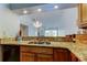Open kitchen boasts granite countertops and a view into the living space at 2547 Stony Brook Ln, Clearwater, FL 33761