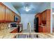 Well-lit kitchen featuring granite countertops and stainless steel appliances at 2547 Stony Brook Ln, Clearwater, FL 33761
