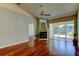 Bright living room featuring hardwood floors, fireplace and access to patio at 2547 Stony Brook Ln, Clearwater, FL 33761