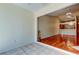 View of the living room with hardwood floors and kitchen in the background at 2547 Stony Brook Ln, Clearwater, FL 33761
