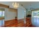 Open living room has a fireplace, hardwood floors, and natural light at 2547 Stony Brook Ln, Clearwater, FL 33761