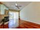 Cozy living room with hardwood floors, fireplace and access to patio at 2547 Stony Brook Ln, Clearwater, FL 33761