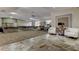 Spacious community area featuring carpeted areas, tiled areas, lots of seating and bookshelves in the background at 2547 Stony Brook Ln, Clearwater, FL 33761
