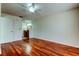Main bedroom featuring hardwood floors with an en suite bathroom at 2547 Stony Brook Ln, Clearwater, FL 33761