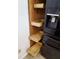 The pantry features custom wood slide out drawers for easy accessible storage at 2547 Stony Brook Ln, Clearwater, FL 33761