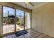 Enclosed patio with tile floors and sliding glass doors to backyard at 2547 Stony Brook Ln, Clearwater, FL 33761