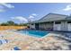 Outdoor pool with clear blue water and an expansive pool deck featuring tables and lounge chairs at 2547 Stony Brook Ln, Clearwater, FL 33761