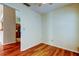 Room features hardwood floors and views into the kitchen at 2547 Stony Brook Ln, Clearwater, FL 33761