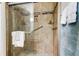 Bathroom shower stall with glass door and tile walls at 2547 Stony Brook Ln, Clearwater, FL 33761