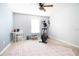 Bright bedroom with an exercise machine and a ceiling fan at 3000 Jacob Crossing Ln, Holiday, FL 34691