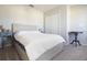 Neutral bedroom featuring a wooden bed frame and a white comforter at 3000 Jacob Crossing Ln, Holiday, FL 34691