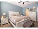 Serene bedroom featuring a large bed, stylish nightstands, and soft blue walls at 3000 Jacob Crossing Ln, Holiday, FL 34691