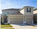 Charming two-story home featuring a two-car garage and neutral colored siding at 3000 Jacob Crossing Ln, Holiday, FL 34691