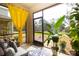 Relaxing screened patio with comfortable seating and lush plants at 3000 Jacob Crossing Ln, Holiday, FL 34691