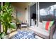 Relaxing screened patio with comfortable seating and view to interior room and exterior natural scenes at 3000 Jacob Crossing Ln, Holiday, FL 34691
