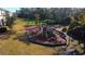 Community playground featuring slides, climbing structures, and swings for enjoyment at 3000 Jacob Crossing Ln, Holiday, FL 34691