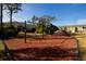 Community playground features slides, swings and play areas surrounded by trees at 3000 Jacob Crossing Ln, Holiday, FL 34691