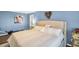 Inviting bedroom featuring neutral tones, plush bedding, and a cozy ambiance, perfect for relaxation and restful nights at 3276 Hilary Cir, Palm Harbor, FL 34684