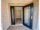 Open black front door with leaded glass, opening into living room with wood-look flooring at 3276 Hilary Cir, Palm Harbor, FL 34684