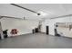 Spacious garage includes storage cabinets and ample room for vehicles and projects at 3276 Hilary Cir, Palm Harbor, FL 34684