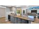 Beautiful kitchen with granite countertop island and sleek, modern appliances at 3276 Hilary Cir, Palm Harbor, FL 34684