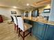 Stylish kitchen featuring a large center island with bar stools for seating at 3276 Hilary Cir, Palm Harbor, FL 34684