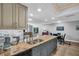 This kitchen features a beautiful granite countertop, stainless steel appliances, and recessed lighting at 3276 Hilary Cir, Palm Harbor, FL 34684