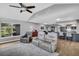 Open-concept living room with furniture and kitchen in background at 3276 Hilary Cir, Palm Harbor, FL 34684