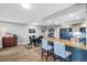 Open concept living space with eating area, granite island, and modern appliances at 3276 Hilary Cir, Palm Harbor, FL 34684