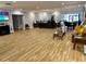Spacious lobby area with wood floors, comfortable seating, and reception desk at 3276 Hilary Cir, Palm Harbor, FL 34684