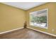 Sunny room overlooking backyard, features hardwood floors and neutral paint at 3276 Hilary Cir, Palm Harbor, FL 34684