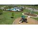 Community amenities including a pool, playground, basketball court, and well-manicured green spaces at 33176 Whisper Pointe Dr, Wesley Chapel, FL 33545
