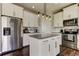 Modern kitchen with stainless steel appliances, an island, and white cabinetry at 33176 Whisper Pointe Dr, Wesley Chapel, FL 33545