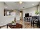 Open living space featuring hardwood floors, ample lighting, and modern furnishings, offering a welcoming atmosphere at 33176 Whisper Pointe Dr, Wesley Chapel, FL 33545