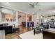 Open-concept living room with hardwood floors and contemporary furniture at 33176 Whisper Pointe Dr, Wesley Chapel, FL 33545