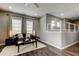 Comfortable living room with hardwood floors, neutral walls, and stylish lighting, perfect for entertaining at 33176 Whisper Pointe Dr, Wesley Chapel, FL 33545