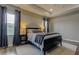 Comfortable main bedroom featuring neutral walls, tray ceiling, plush carpet, and lots of natural light at 33176 Whisper Pointe Dr, Wesley Chapel, FL 33545