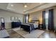 Spacious main bedroom with a tray ceiling, plush carpet, and ample natural light at 33176 Whisper Pointe Dr, Wesley Chapel, FL 33545