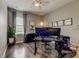 This office features hardwood floors, natural light, and modern decor at 33176 Whisper Pointe Dr, Wesley Chapel, FL 33545