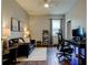 Functional home office with stylish furniture, hardwood floors, and ample lighting, creating a productive workspace at 33176 Whisper Pointe Dr, Wesley Chapel, FL 33545