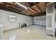Unfinished basement featuring a large garage door and lots of space for storage at 36846 Jefferson Ave, Dade City, FL 33523