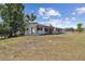 Beautifully renovated one-story home with manicured lawn and lush landscaping at 36846 Jefferson Ave, Dade City, FL 33523
