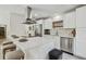 Modern kitchen featuring white cabinets, a kitchen island with seating, and stainless steel appliances at 36846 Jefferson Ave, Dade City, FL 33523