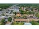 An aerial view showcases the location of the property near a shopping center and a major roadway at 3709 Greenery Ct # 209, Tampa, FL 33618